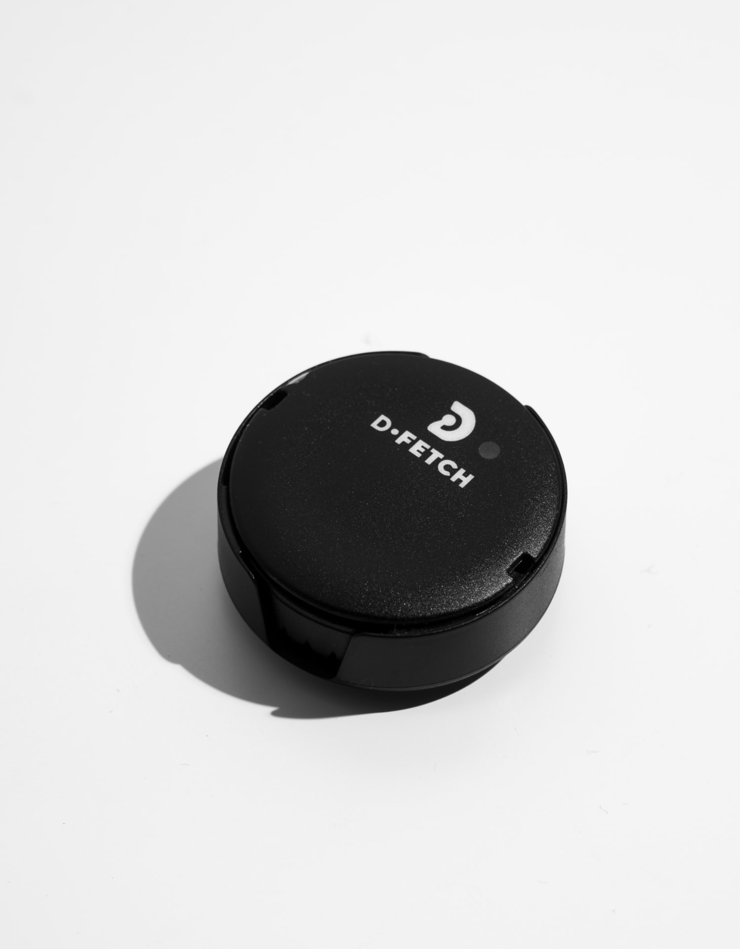 D-Fetch sensor resting on a plain light surface